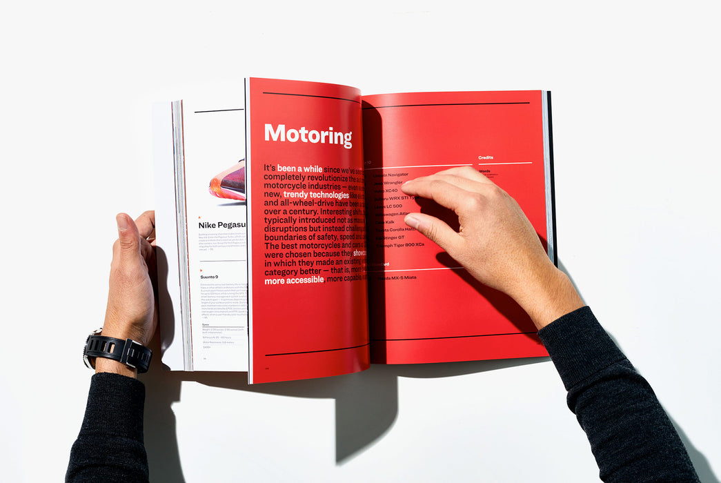 Gear Patrol Magazine, Issue Eight - Image of someone flipping to the Motoring section