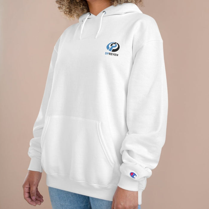 woman wearing a white crewneck sweatshirt with the DPreview logo