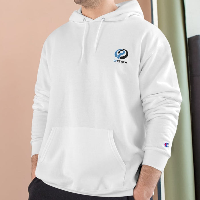 man wearing a white crewneck sweatshirt with the DPreview logo