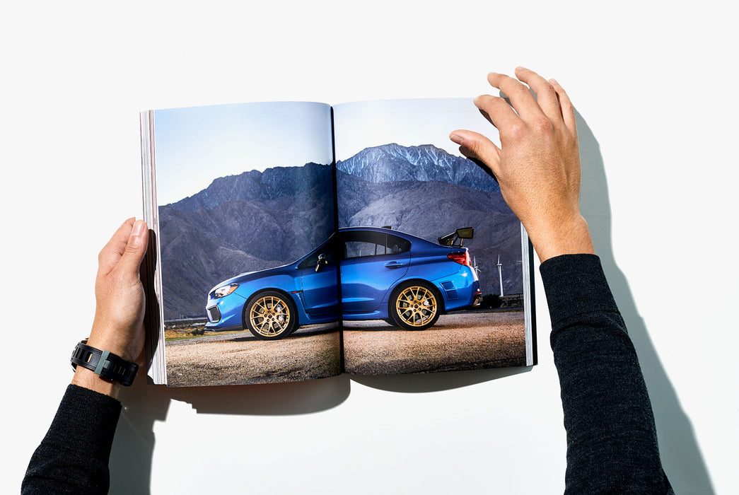 Gear Patrol Magazine, Issue Eight - Open to Spread showing blue car in front of mountains